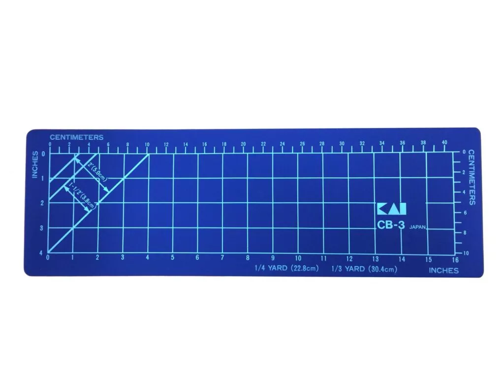 Skjærematte 460x150x2 mm med mørkeblå bunnfarge og cm- og inch-markeringer
