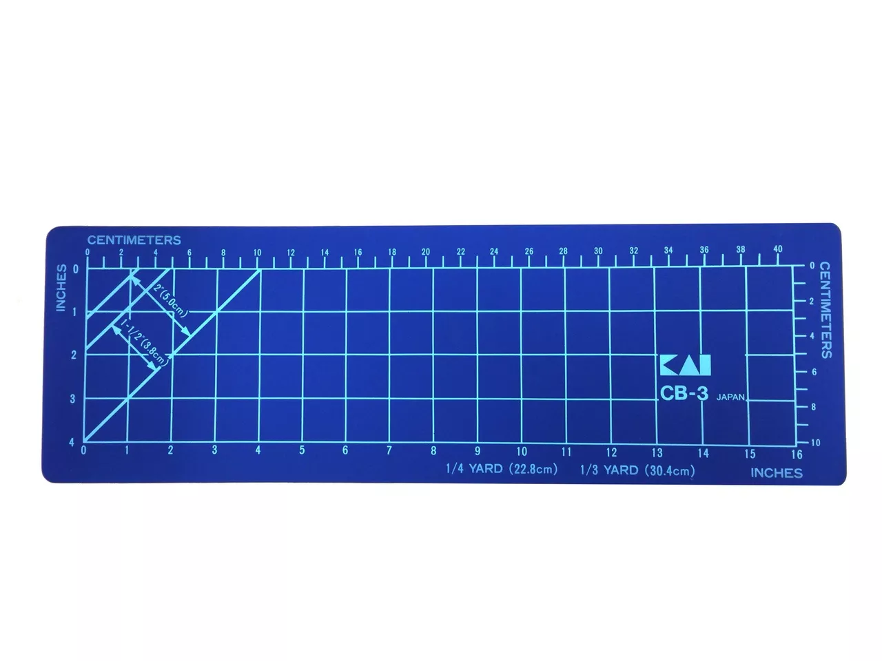 Skjærematte 460x150x2 mm med mørkeblå bunnfarge og cm- og inch-markeringer